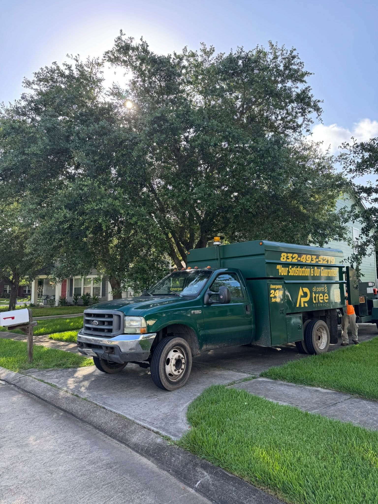 All Points Tree Service chipper truck at a residential worksite