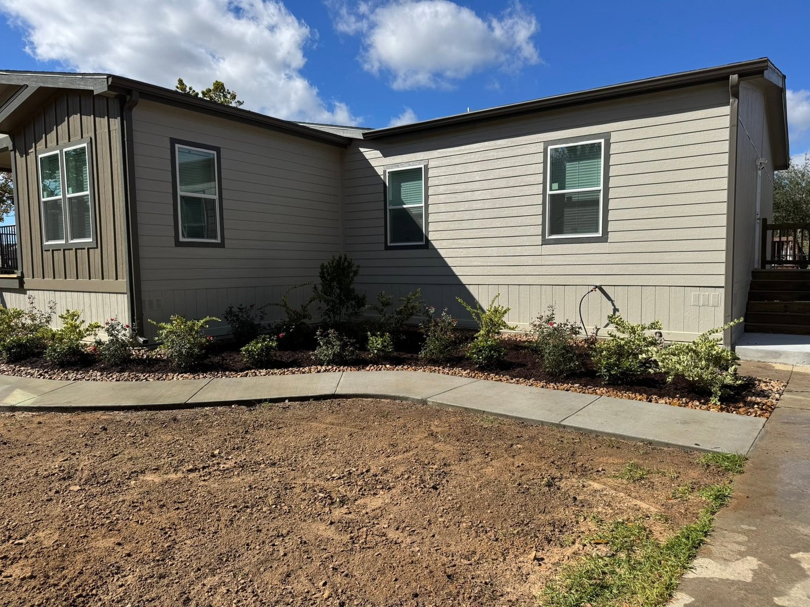 Residential property after planting and landscape restoration