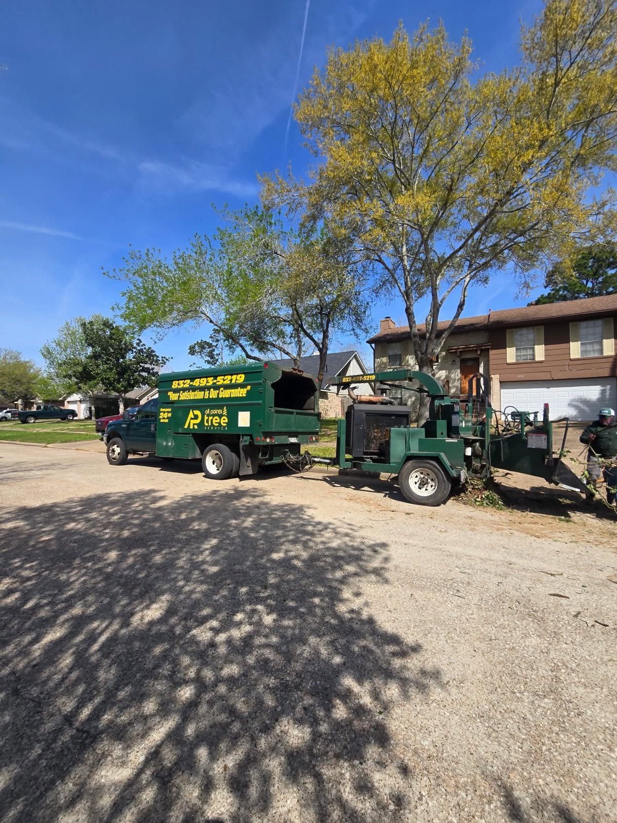 All Points Tree Service truck and chipper at a completed worksite